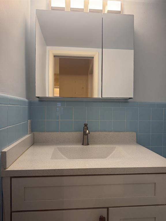 2050 Northeast 39th Street, Unit 211W Lighthouse Point, FL 33064 - Photo 11 of 30 a bathroom with a sink and a mirror