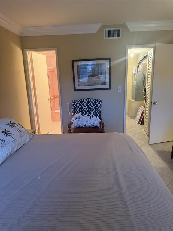 2050 Northeast 39th Street, Unit 211W Lighthouse Point, FL 33064 - Photo 17 of 30 a bedroom with a bed and window