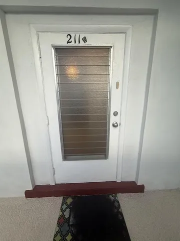 a view of walk in closet with clothes