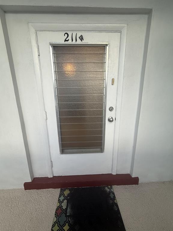 2050 Northeast 39th Street, Unit 211W Lighthouse Point, FL 33064 - Photo 2 of 30 a view of walk in closet with clothes