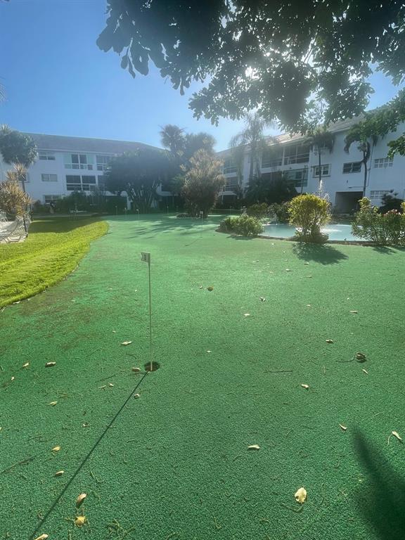 2050 Northeast 39th Street, Unit 211W Lighthouse Point, FL 33064 - Photo 25 of 30 a backyard of a house with lots of green space