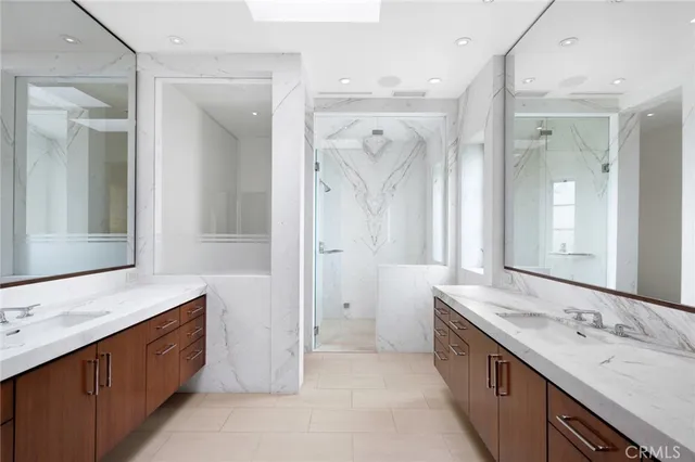 a bathroom with a double vanity sink mirror and double