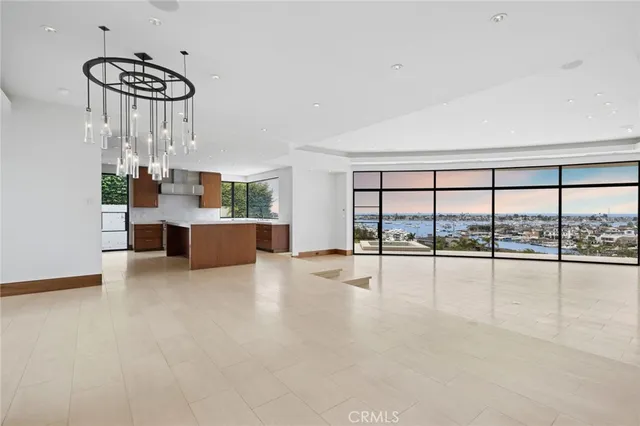 a view of a living room and kitchen with a large window