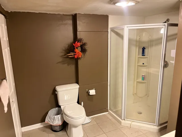 a bathroom with a mirror and a shower