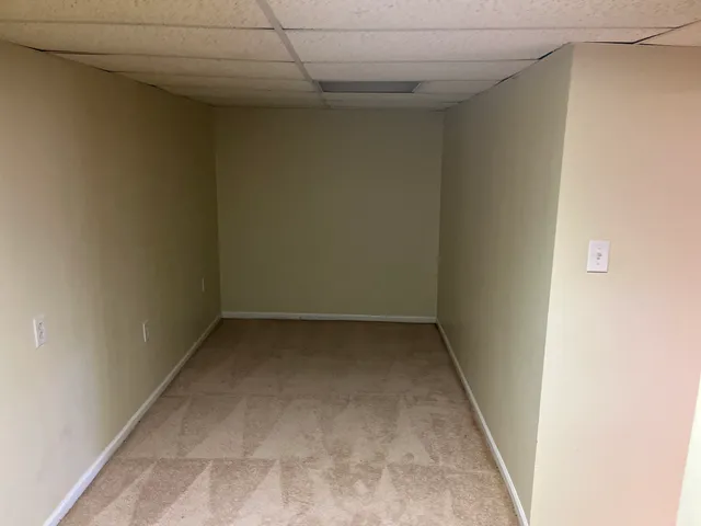 an empty room with a bench