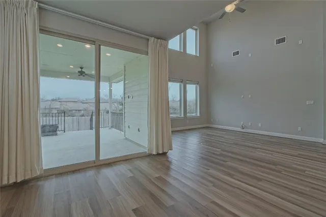 a kitchen with white cabinets and appliances