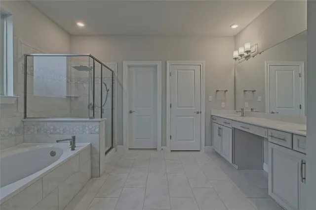 an empty room with windows and chandelier fan