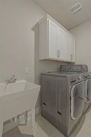 a spacious bathroom with a granite countertop sink a toilet a mirror and shower