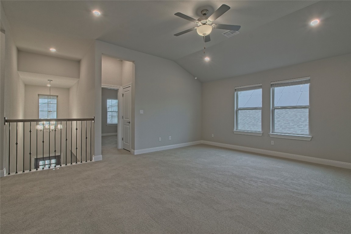 324 Windom Way Georgetown, TX 78626 - Photo 22 of 40 Empty room with recessed lighting, vaulted ceiling, ceiling fan, a chandelier, and carpet