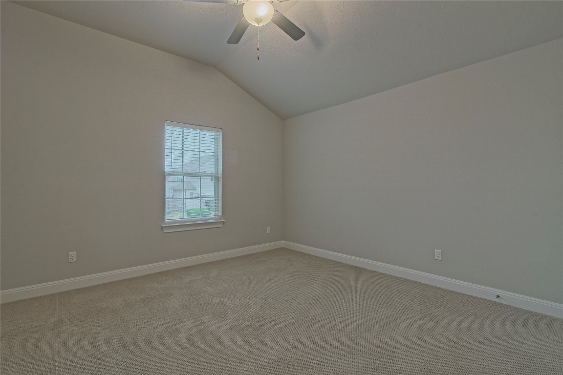 324 Windom Way Georgetown, TX 78626 - Photo 25 of 40 Unfurnished room with lofted ceiling, light carpet, and ceiling fan