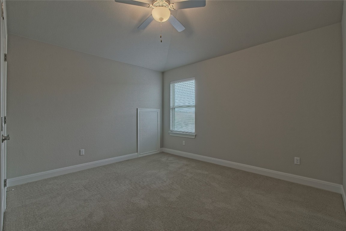 324 Windom Way Georgetown, TX 78626 - Photo 29 of 40 Carpeted spare room featuring baseboards and ceiling fan