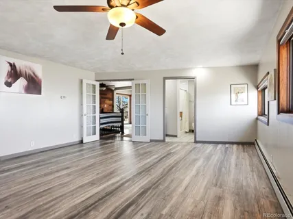 wooden floor in an empty room with a window