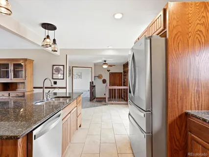 a very nice looking kitchen with a large window