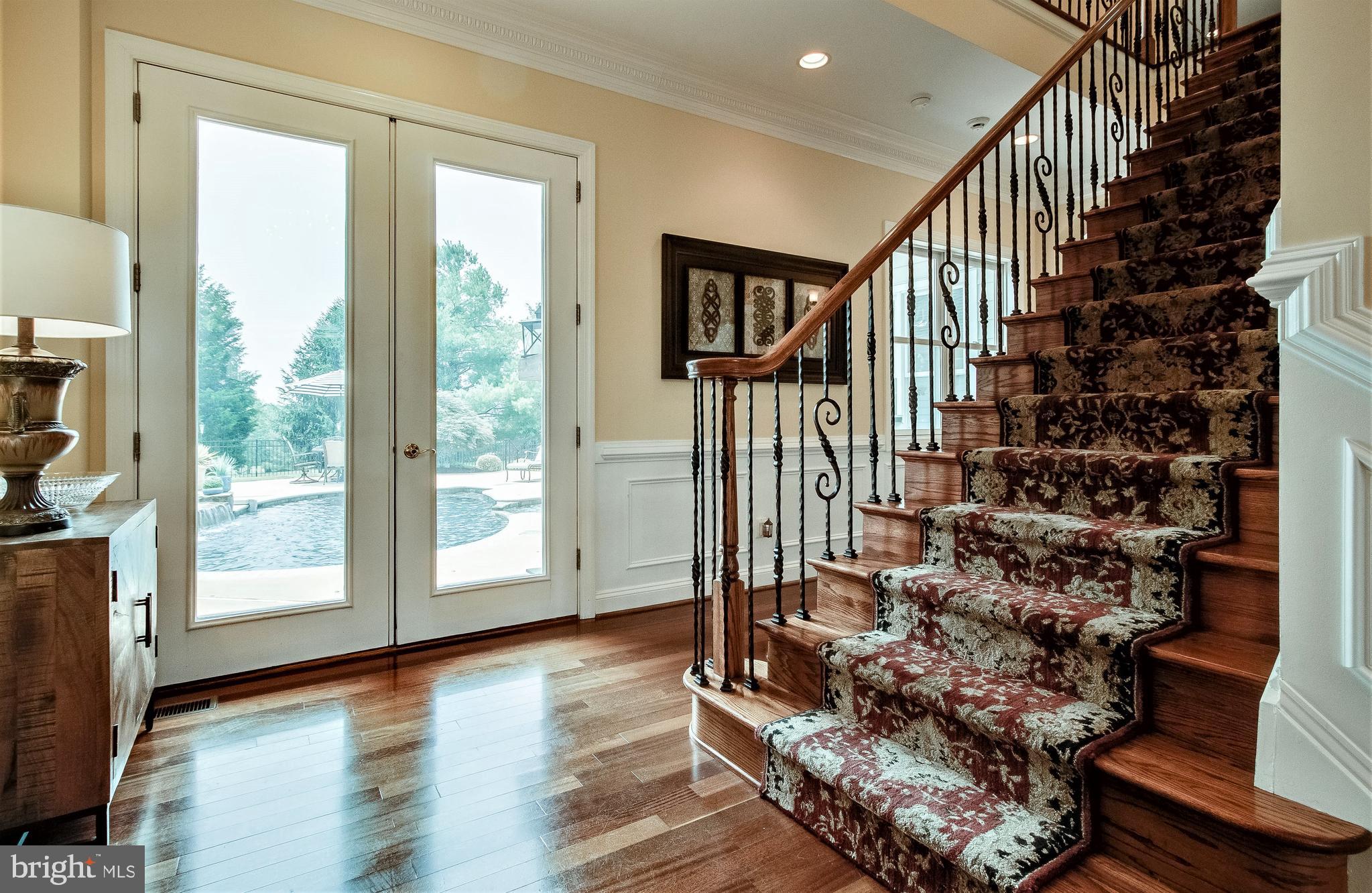 8276 Roxborough Loop Gainesville, VA 20155 - Photo 17 of 101 Doors to Central Patio & Pool off Foyer