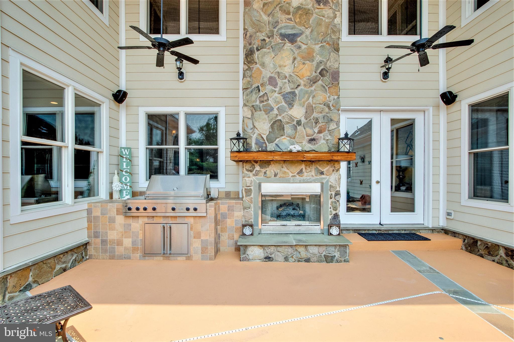 8276 Roxborough Loop Gainesville, VA 20155 - Photo 34 of 101 Two-Story Stone Fireplace & Grilling Station