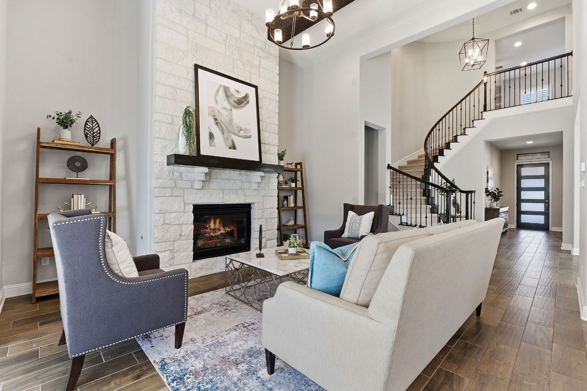 a living room with furniture and a fireplace