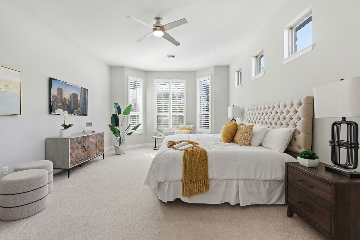 4020 Logan Ridge Drive Cedar Park, TX 78613 - Photo 20 of 40 Bedroom with multiple windows, carpet floors, and a ceiling fan
