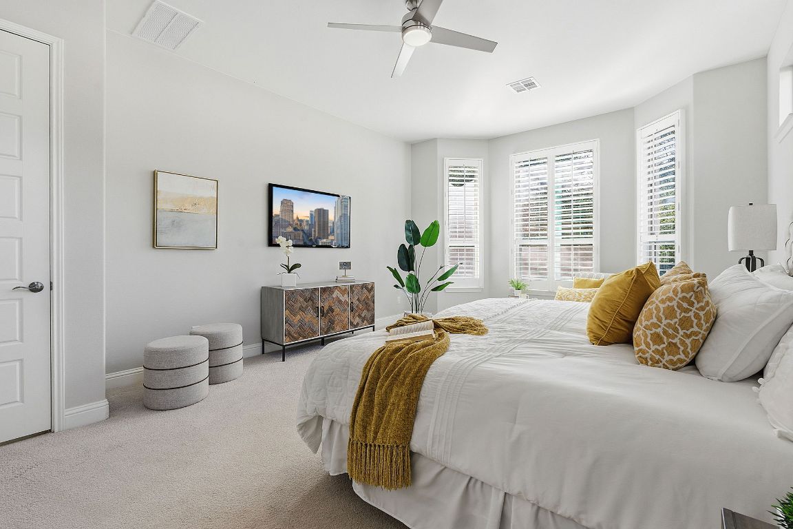 4020 Logan Ridge Drive Cedar Park, TX 78613 - Photo 21 of 40 Carpeted bedroom with ceiling fan and baseboards