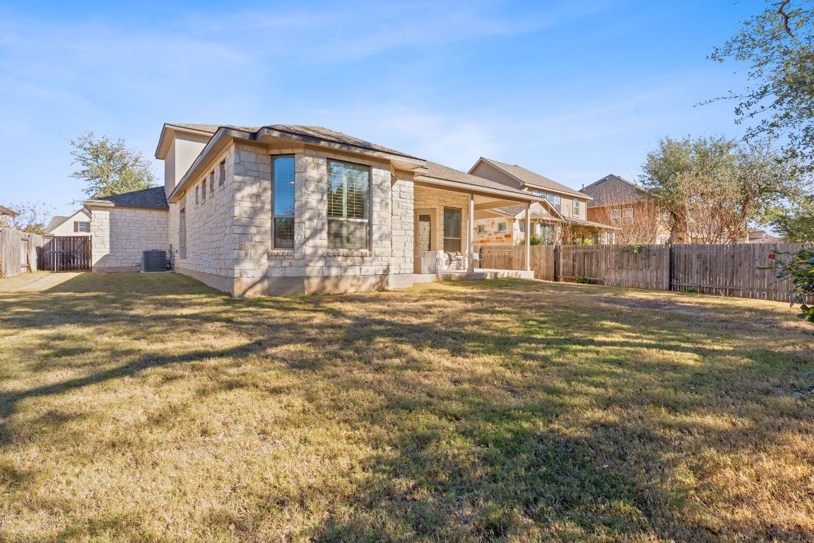 4020 Logan Ridge Drive Cedar Park, TX 78613 - Photo 33 of 40 Back of house with a patio and stone siding