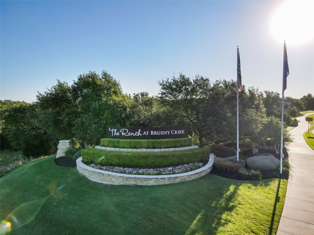 4020 Logan Ridge Drive Cedar Park, TX 78613 - Photo 36 of 40 Community / neighborhood sign with a yard