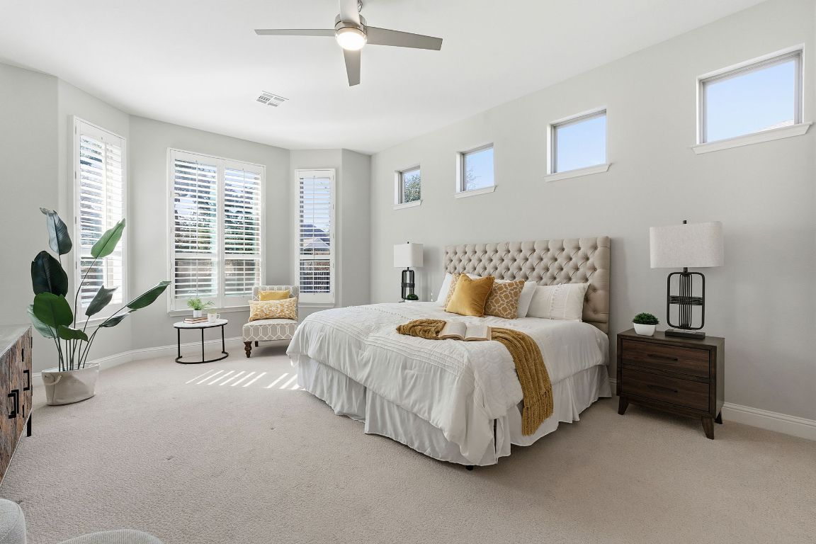 4020 Logan Ridge Drive Cedar Park, TX 78613 - Photo 5 of 40 Bedroom featuring multiple windows, carpet floors, and ceiling fan