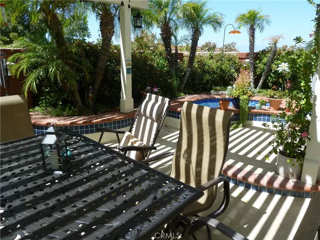 a view of a chairs and table in the patio