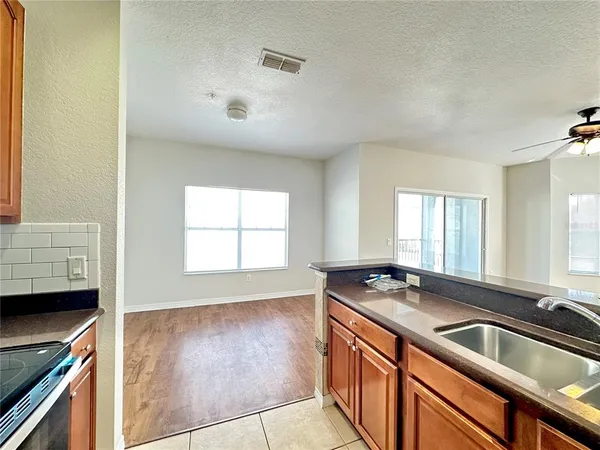 a kitchen that has a sink and a stove