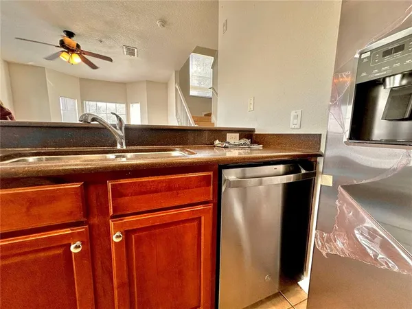 a utility room with two sink and a mirror