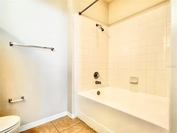 a bathroom with a bathtub and shower
