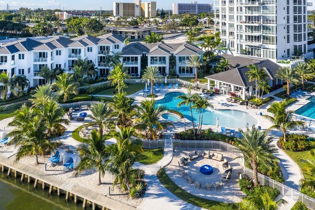 a view of a house with yard and sitting area