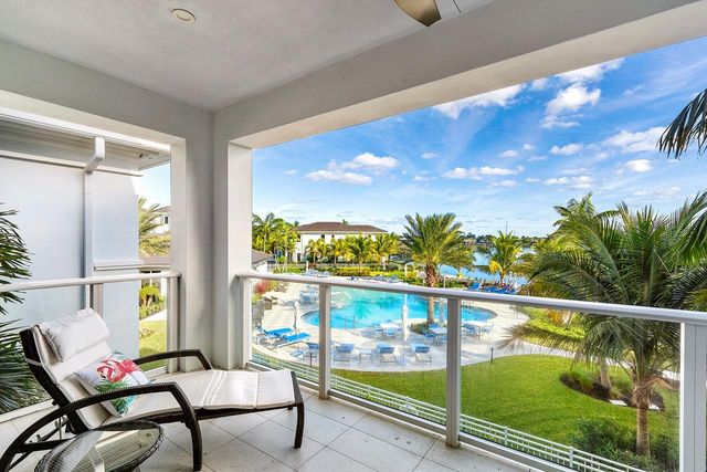 a view of a balcony with chair and table