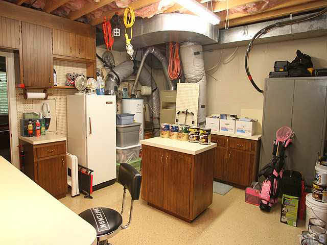 5024 Trail Ridge Drive Raleigh, NC 27613 - Photo 22 of 25 You are going to love this great workshop in the basement, it is heated and cooled