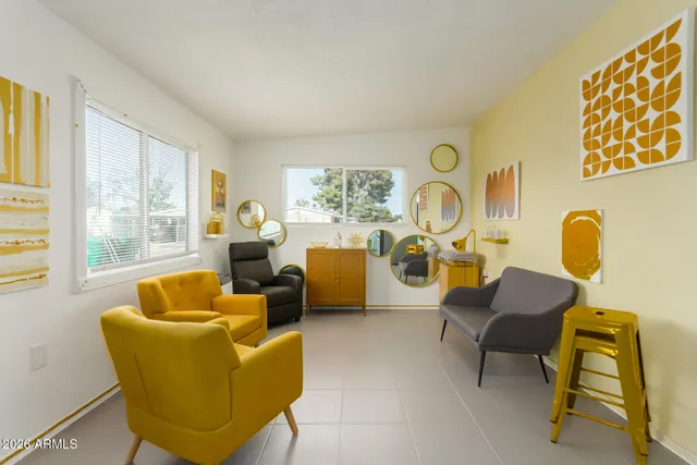 a living room with furniture and a window