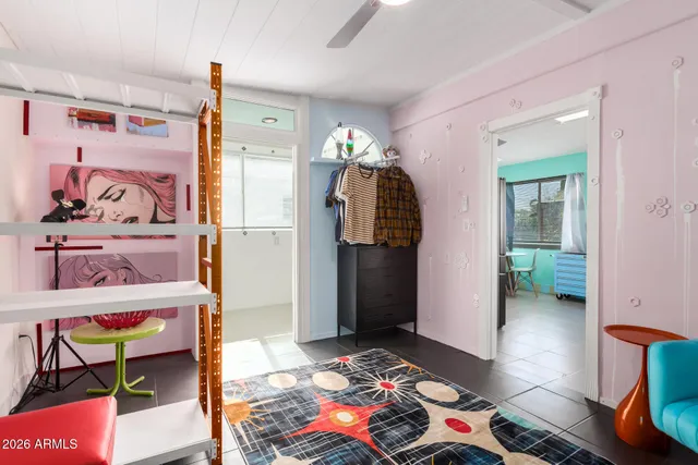 a bedroom with a bed and a mirror