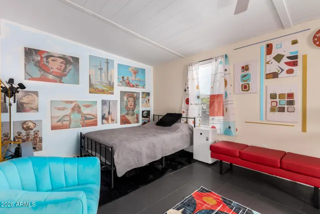 a bedroom with a bed and a couch