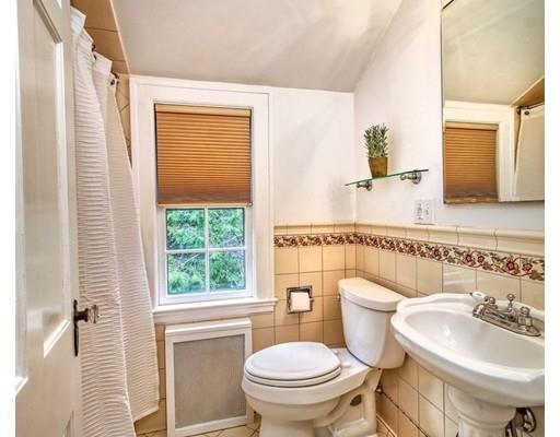 210 Varick Road Newton, MA 02468 - Photo 11 of 19 a bathroom with a sink a toilet and a window