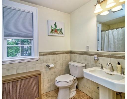210 Varick Road Newton, MA 02468 - Photo 12 of 19 a bathroom with a toilet sink and mirror