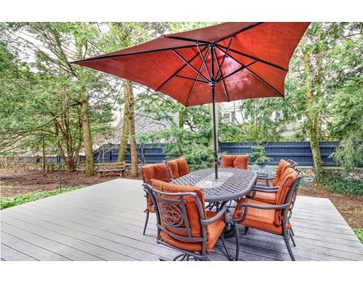 210 Varick Road Newton, MA 02468 - Photo 15 of 19 an outdoor space with furniture and umbrella