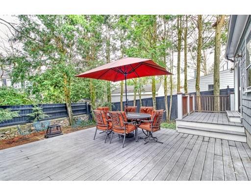210 Varick Road Newton, MA 02468 - Photo 16 of 19 a view of house with wooden deck and outdoor seating