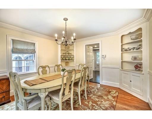 210 Varick Road Newton, MA 02468 - Photo 4 of 19 a view of a dining room with furniture and chandelier
