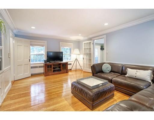 210 Varick Road Newton, MA 02468 - Photo 5 of 19 a living room with furniture and a flat screen tv