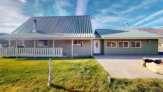 a front view of a house with swimming pool