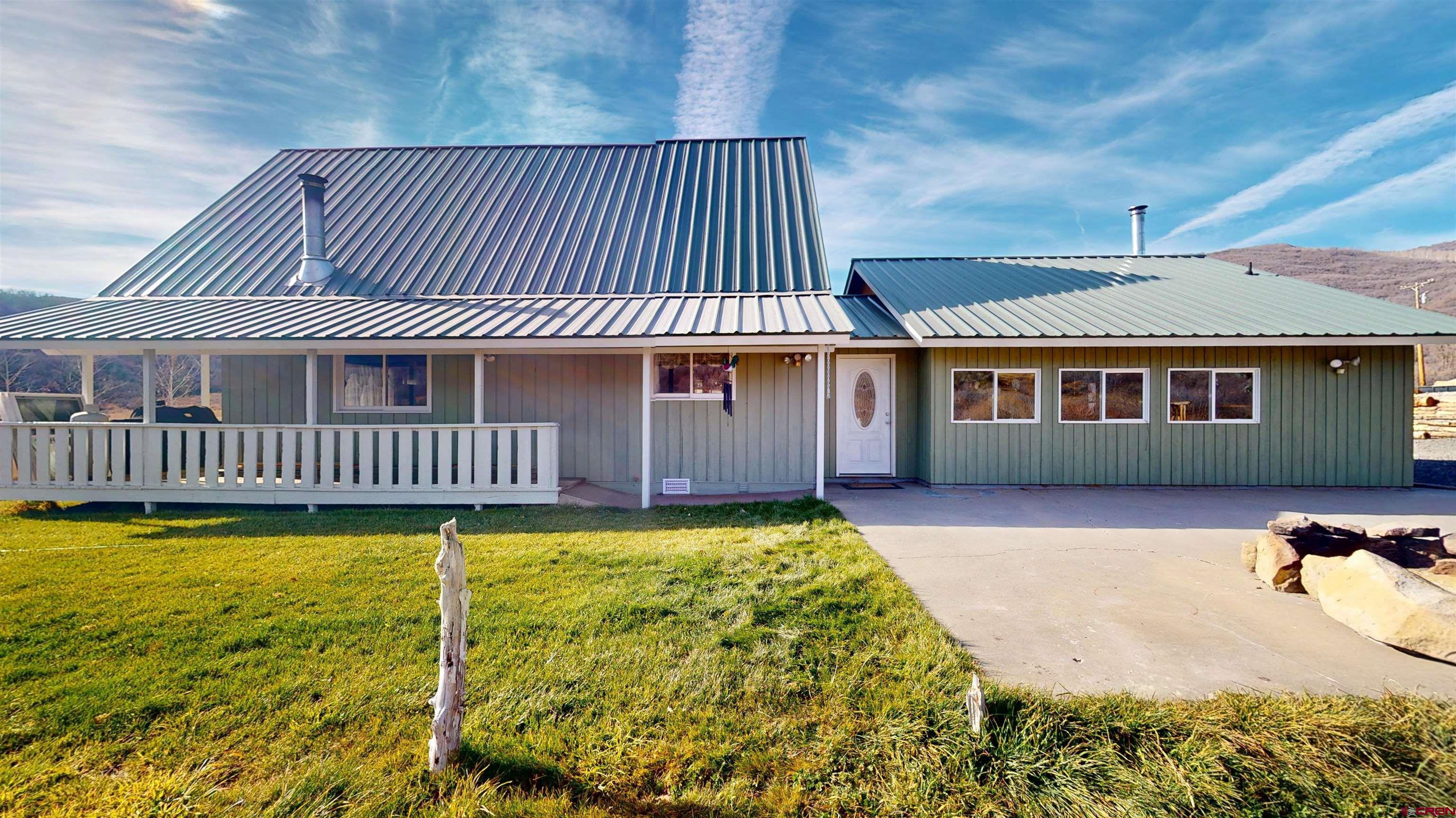 19253 Stevens Gulch Road Paonia, CO 81428 - Photo 24 of 45 a front view of a house with swimming pool