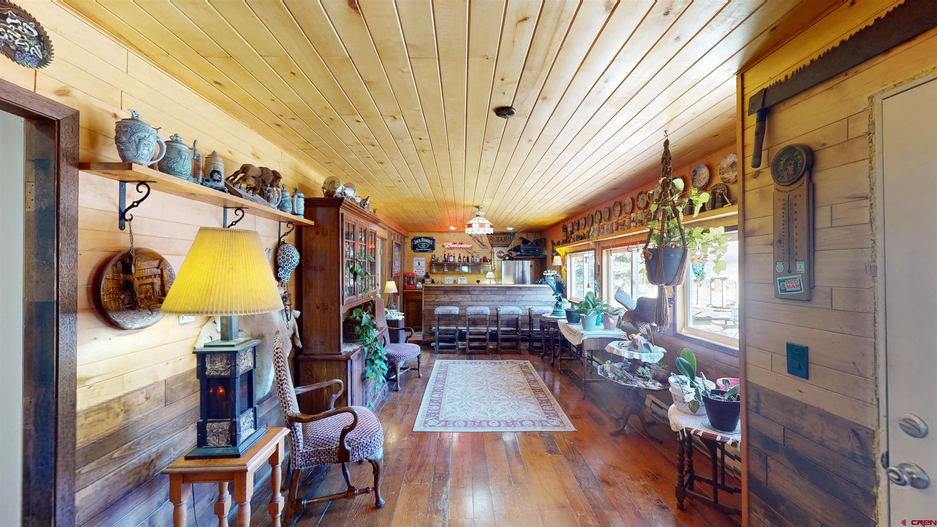 19253 Stevens Gulch Road Paonia, CO 81428 - Photo 33 of 45 a view of living room with furniture and a chandelier
