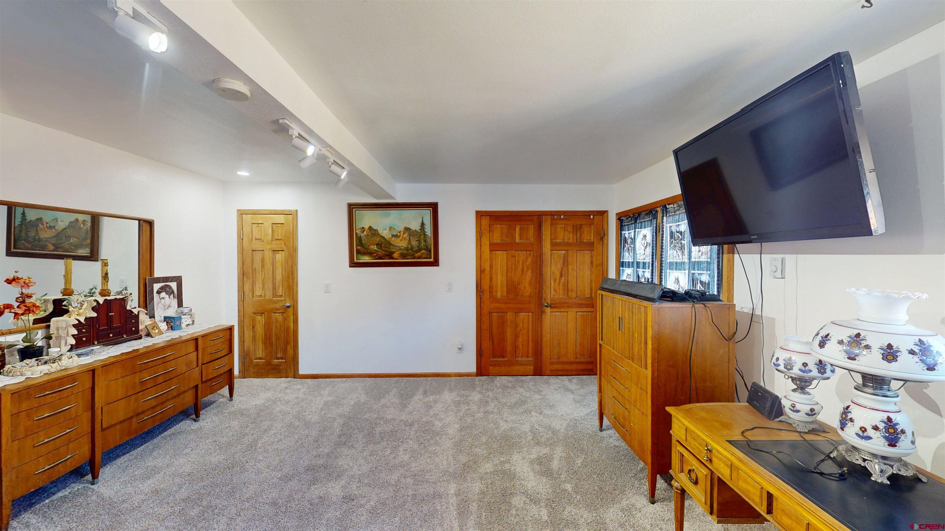 19253 Stevens Gulch Road Paonia, CO 81428 - Photo 40 of 45 a bed room with furniture and a window