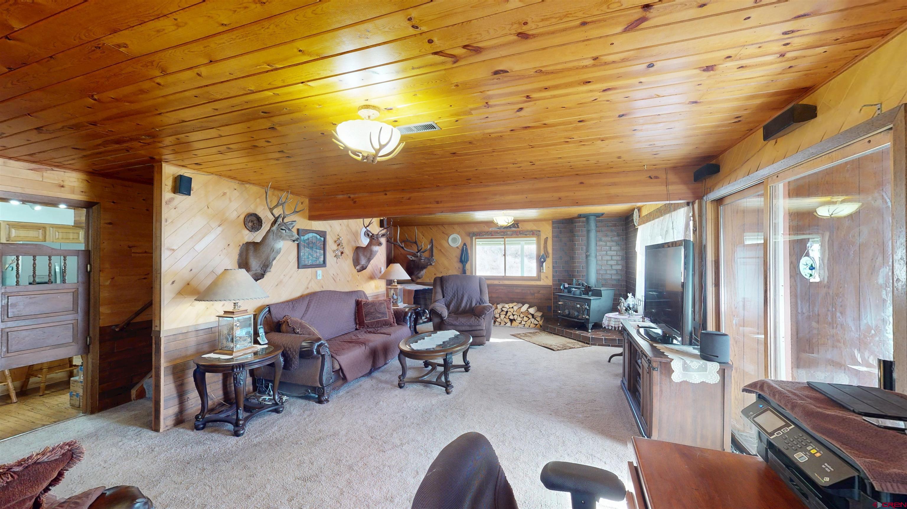 19253 Stevens Gulch Road Paonia, CO 81428 - Photo 5 of 45 a living room with furniture and a large window
