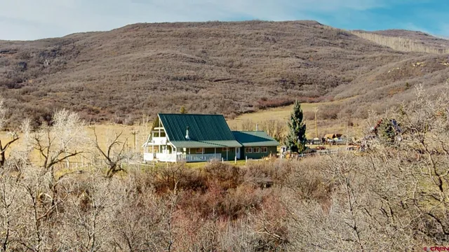a aerial view of a house with a yard