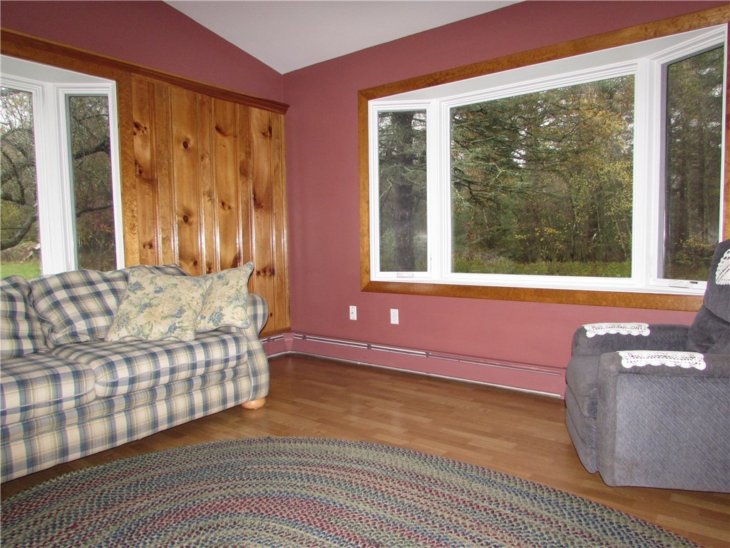 1132 Reynolds Road Glocester, RI 02814 - Photo 12 of 26 Great sitting area could serve as an additional bedroom when guests arrive. See the wildlife in may directions from the comfort of this room.