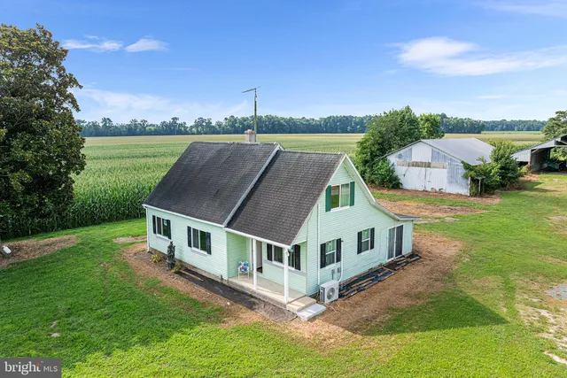 a aerial view of a house with a big yard