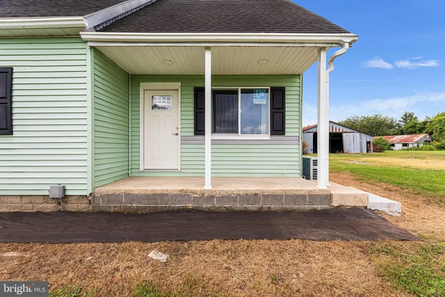 a view of a house with garden and yard
